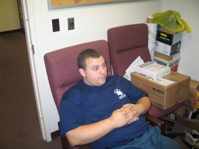 Former Career EMT Matt Blakeley sitting quietly and learning for his future in the fire service.